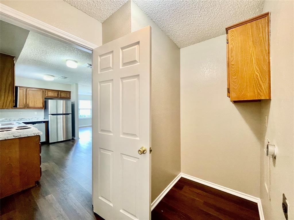 524 Strata Drive Denton, TX 76201 - Photo 6 of 17 a view of a hallway with wooden floor and closet