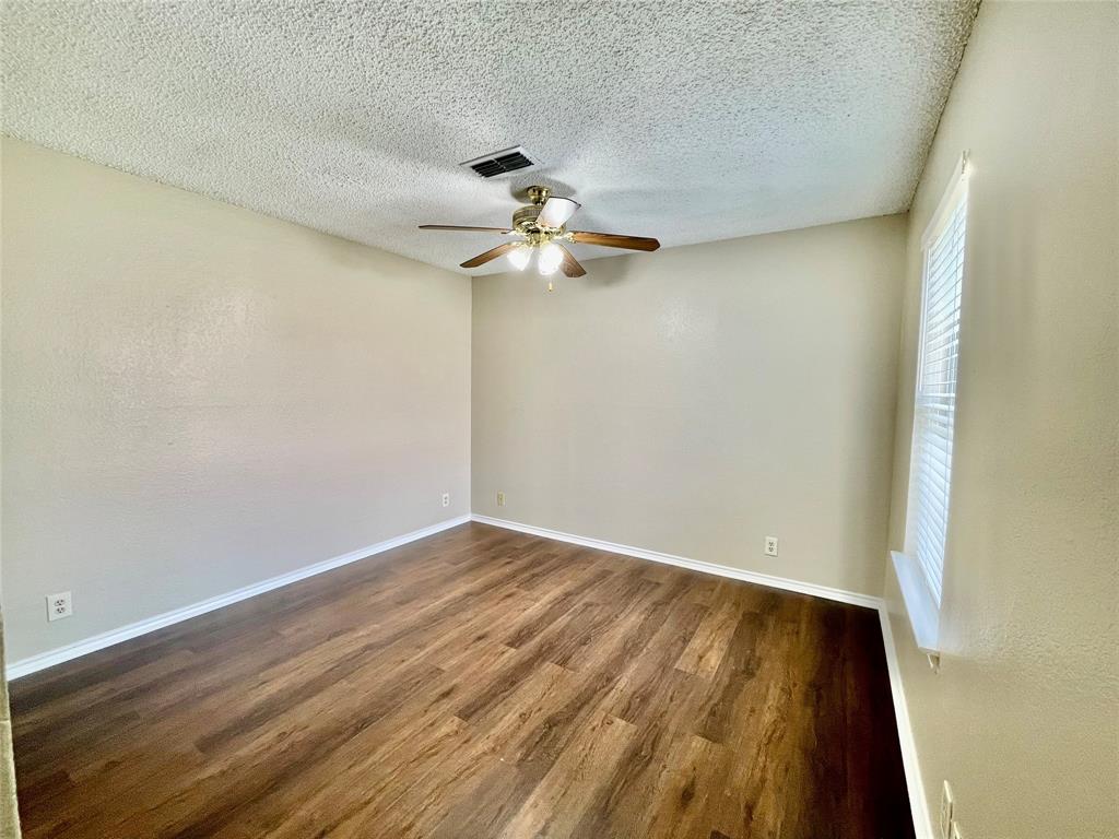 524 Strata Drive Denton, TX 76201 - Photo 7 of 17 wooden floor in an empty room