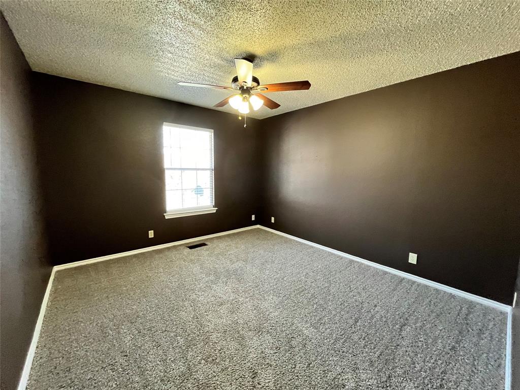 524 Strata Drive Denton, TX 76201 - Photo 10 of 17 Notice all of the electric outlets. This space has fantastic lighting, some from the natural light coming in from the window, and great light coming from the ceiling fan which will keep this space cool.