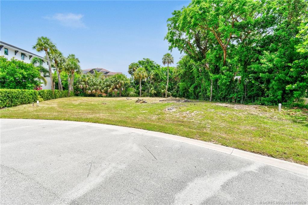 108 Island Dunes Cove Jensen Beach, FL 34957 - Photo 17 of 35 a view of a big yard with large trees