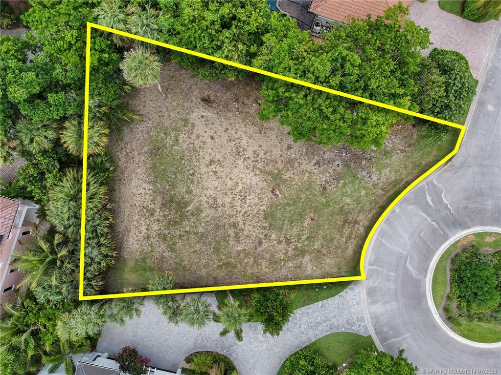 108 Island Dunes Cove Jensen Beach, FL 34957 - Photo 2 of 35 a view of a balcony with floor to ceiling windows and wooden fence