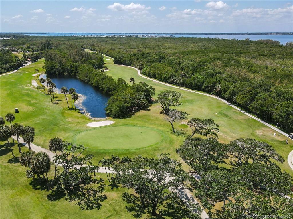 108 Island Dunes Cove Jensen Beach, FL 34957 - Photo 32 of 35 a view of a lake with a yard