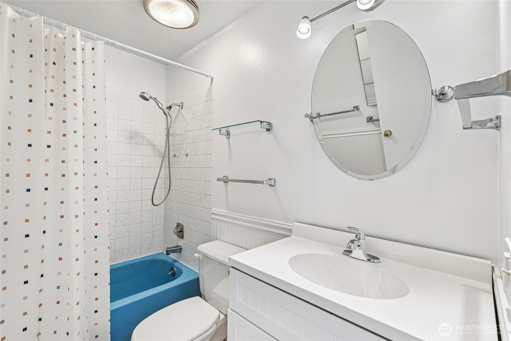 7909 218th Street Southwest, Unit 4 Edmonds, WA 98026 - Photo 19 of 29 a bathroom with a sink toilet a mirror and shower