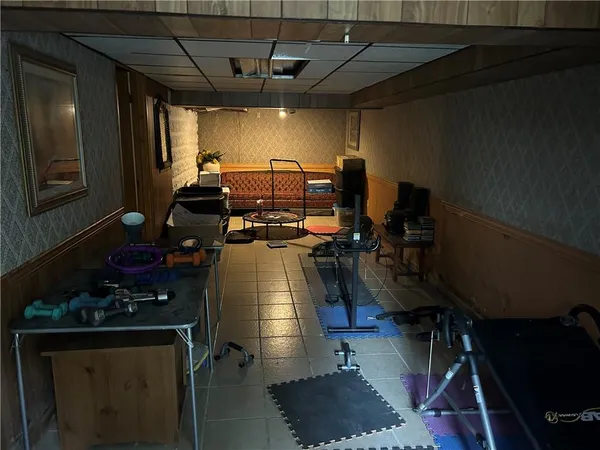 a view of a room with wooden floor and stairs