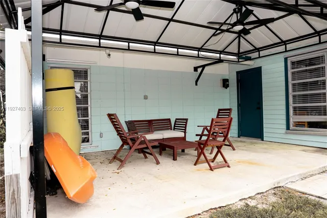 a patio with table and chairs