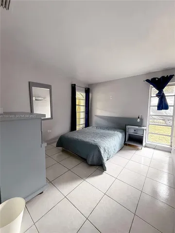 a view of a livingroom with furniture and a flat screen tv