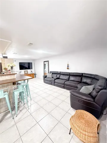 a living room with couch and a table