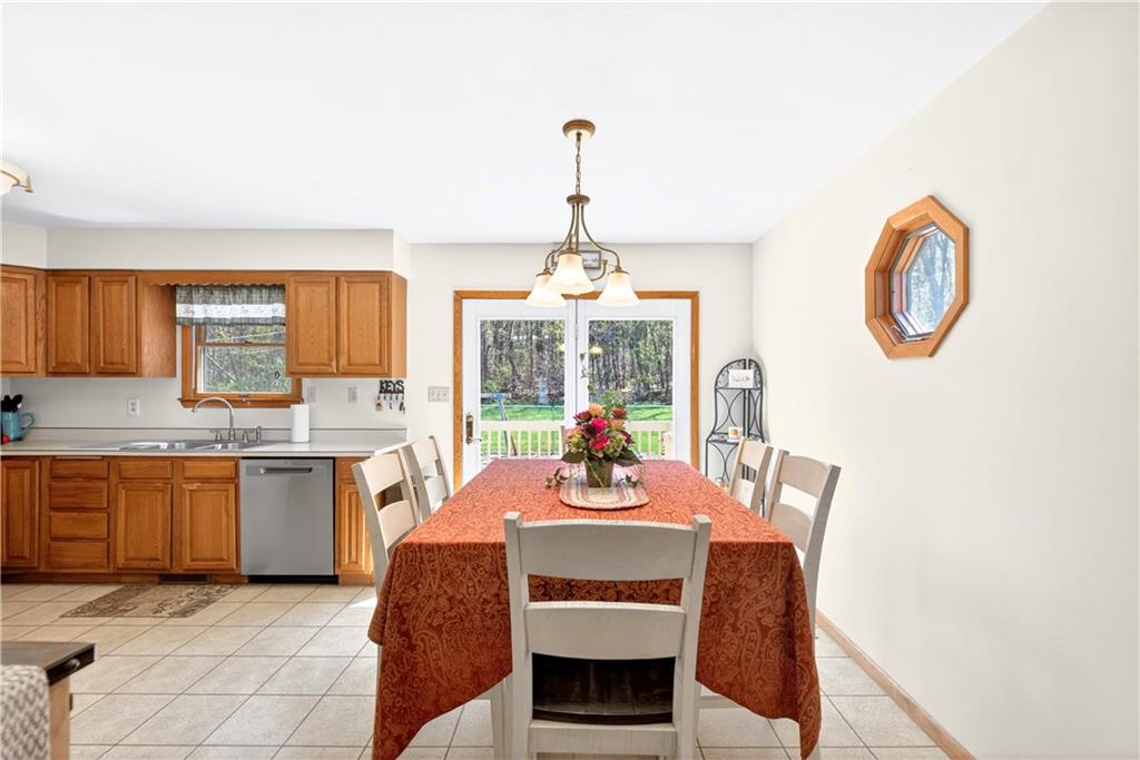 24 Sevich Alley Monongahela, PA 15063 - Photo 15 of 48 a dining room with furniture a chandelier and a rug