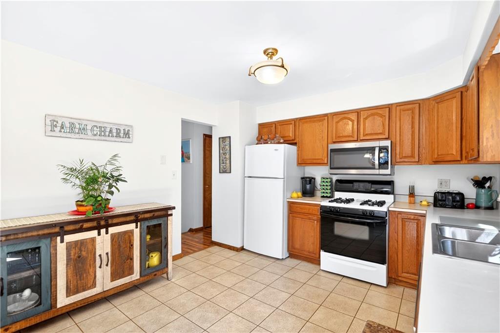 24 Sevich Alley Monongahela, PA 15063 - Photo 17 of 48 a kitchen with stainless steel appliances granite countertop a stove a refrigerator and a microwave