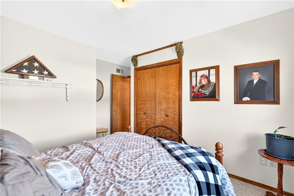 24 Sevich Alley Monongahela, PA 15063 - Photo 27 of 48 a bedroom with a bed and a chandelier