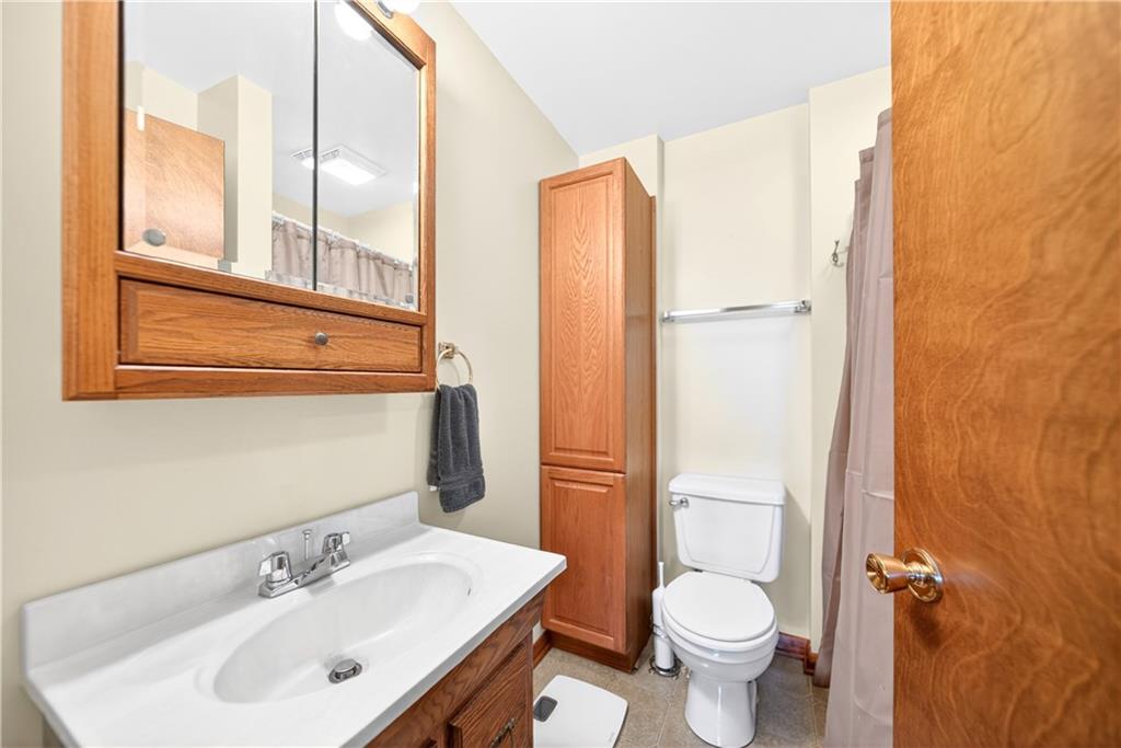 24 Sevich Alley Monongahela, PA 15063 - Photo 36 of 48 a bathroom with a toilet sink and a mirror