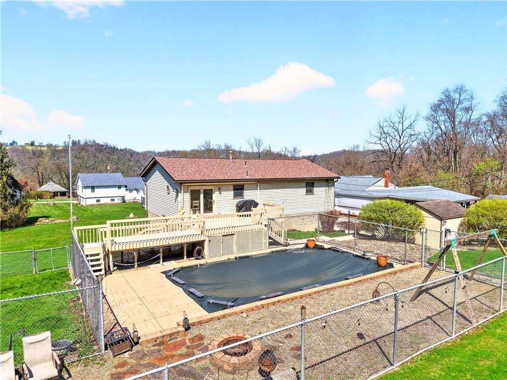 24 Sevich Alley Monongahela, PA 15063 - Photo 4 of 48 a view of house with outdoor space swimming pool and mountains in the background