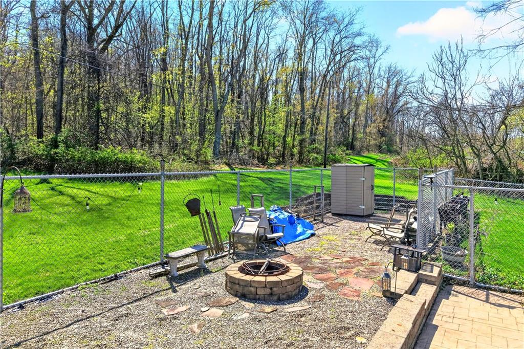 24 Sevich Alley Monongahela, PA 15063 - Photo 6 of 48 a table and chairs with the garden in the back