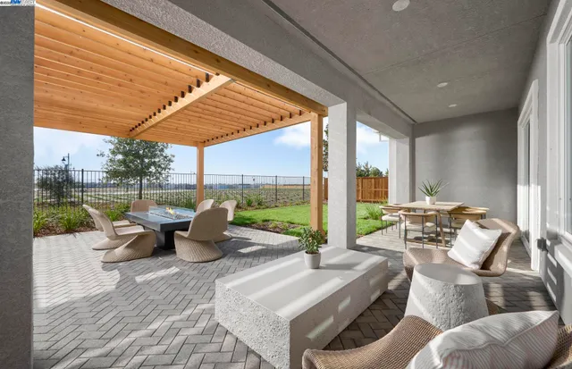a roof deck with couches and pool