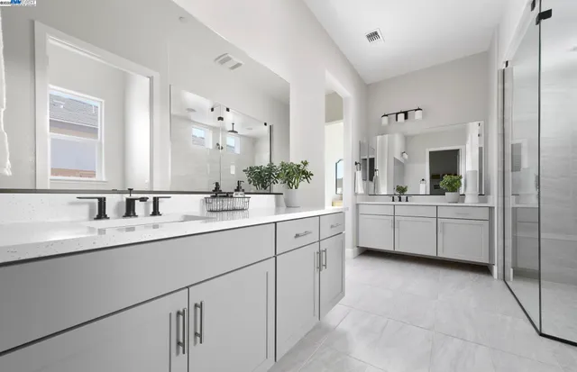 a bathroom with a sink a vanity and a mirror