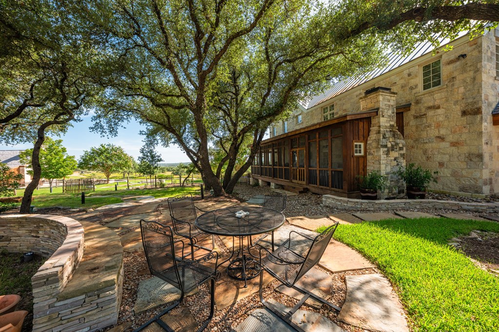 1400 Arbor Ridge Road Fredericksburg, TX 78624 - Photo 22 of 37 Screened Porch and Side Lawn