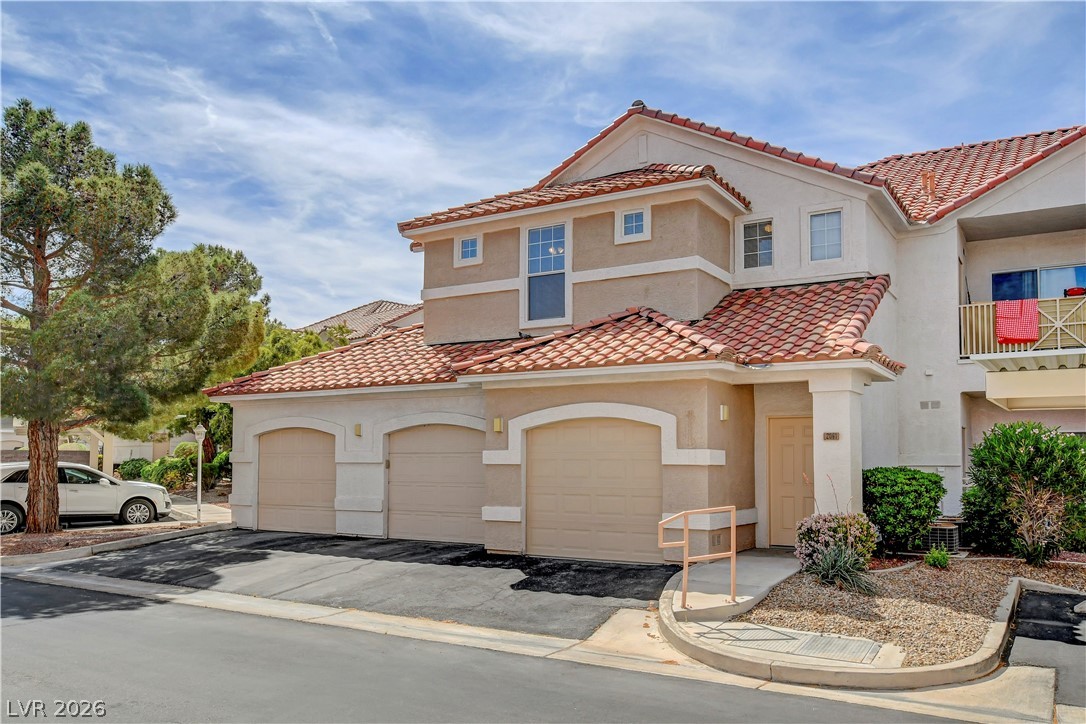 8555 West Russell Road, Unit 2091 Las Vegas, NV 89113 - Photo 1 of 26 Unit #2091's garage next to door.