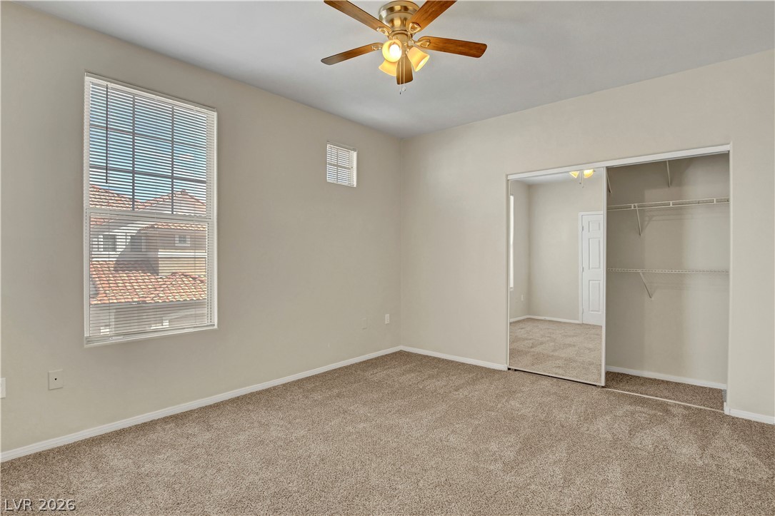 8555 West Russell Road, Unit 2091 Las Vegas, NV 89113 - Photo 14 of 26 Featuring carpet floors, a ceiling fan, and a closet