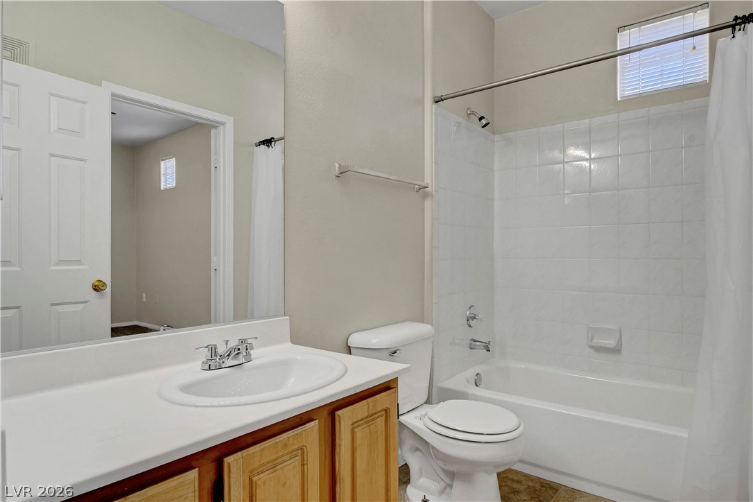 8555 West Russell Road, Unit 2091 Las Vegas, NV 89113 - Photo 17 of 26 Bathroom with vanity, plenty of natural light, and shower / tub combo