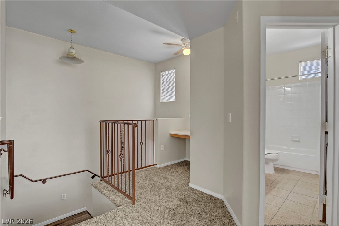 8555 West Russell Road, Unit 2091 Las Vegas, NV 89113 - Photo 20 of 26 Corridor with an upstairs landing, and plenty of natural light