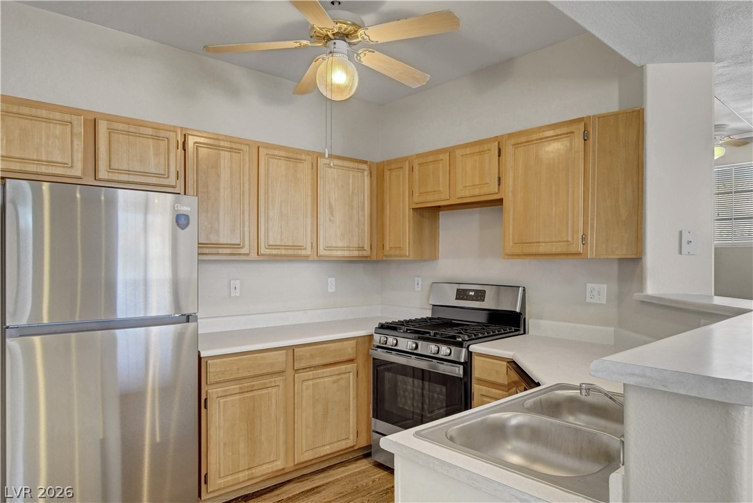 8555 West Russell Road, Unit 2091 Las Vegas, NV 89113 - Photo 7 of 26 Kitchen with a ceiling fan, new stainless steel appliances.