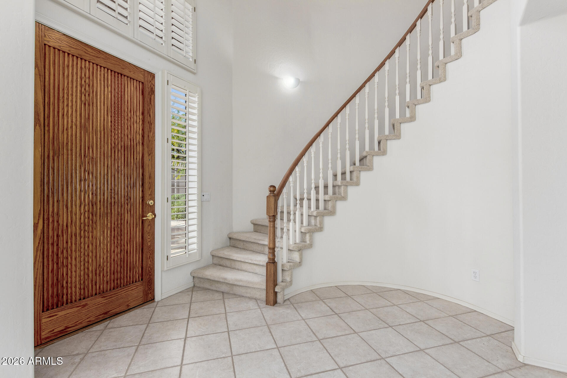 3430 North Mountain Ridge, Unit 13 Mesa, AZ 85207 - Photo 13 of 115 a view of entryway and hall with a window