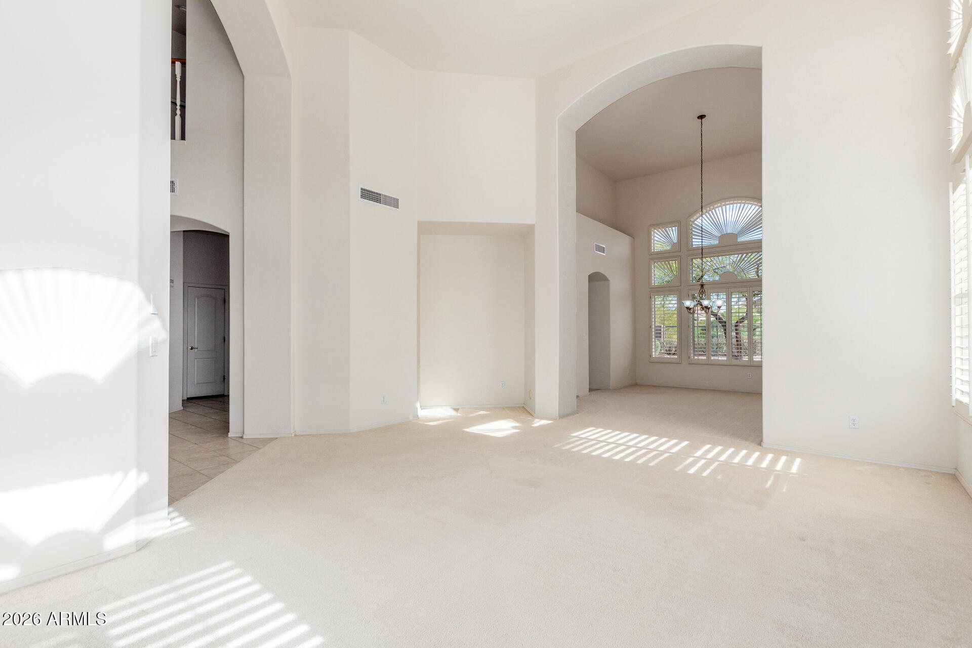 3430 North Mountain Ridge, Unit 13 Mesa, AZ 85207 - Photo 17 of 115 a view of an empty room with window and bathroom