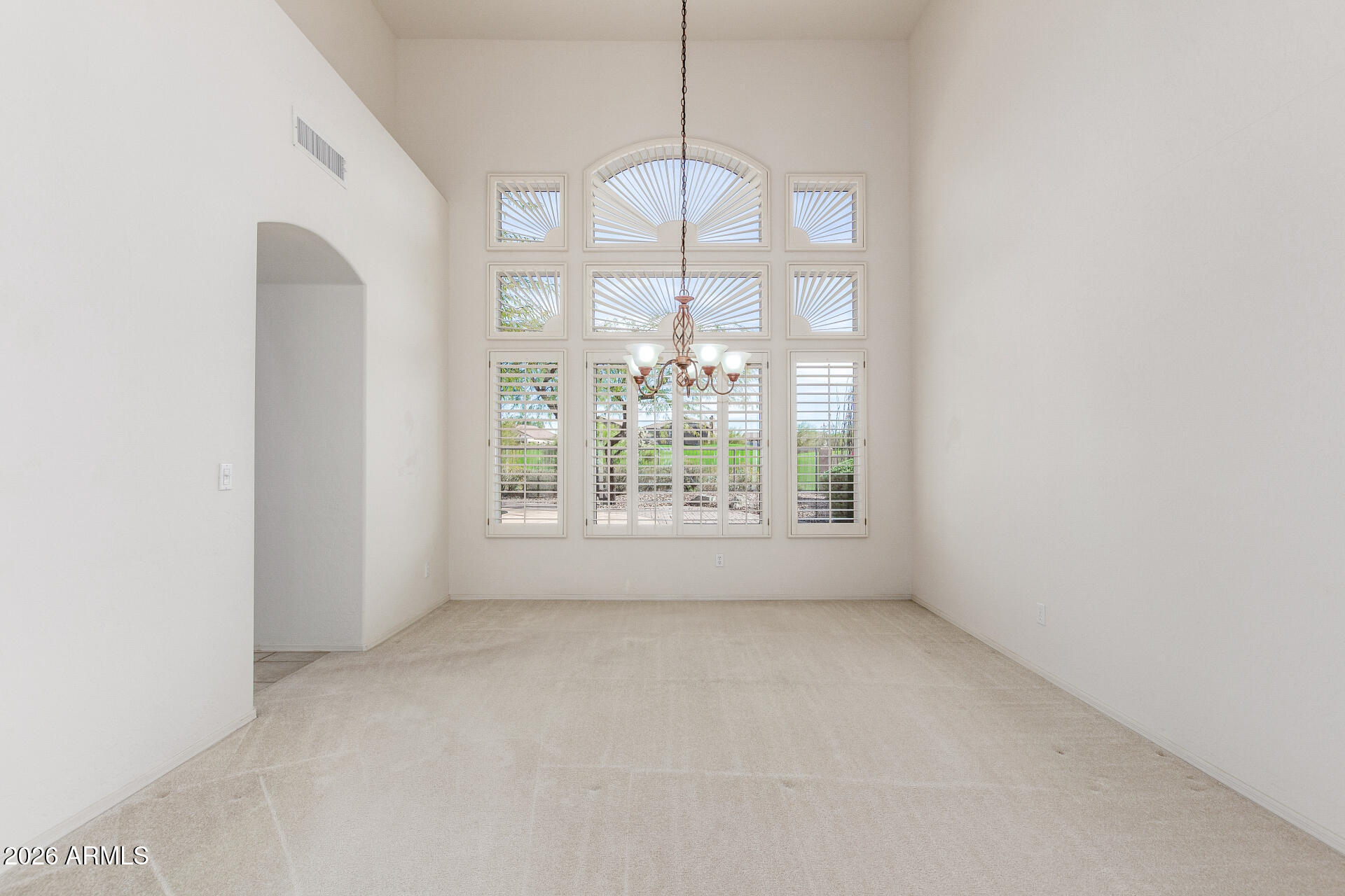 3430 North Mountain Ridge, Unit 13 Mesa, AZ 85207 - Photo 19 of 124 a view of an empty room with a window