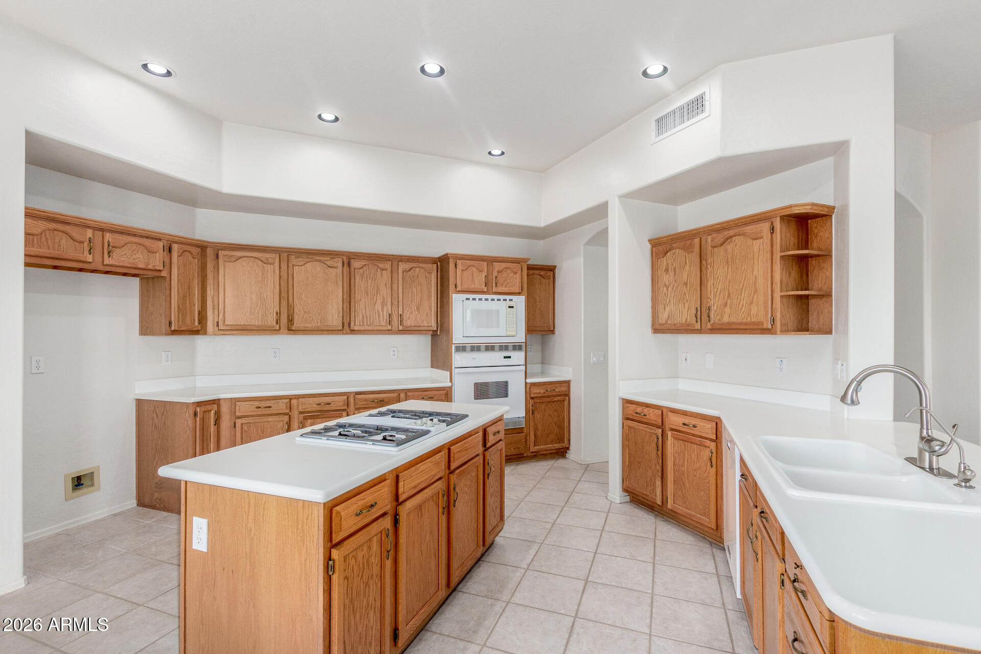 3430 North Mountain Ridge, Unit 13 Mesa, AZ 85207 - Photo 22 of 115 a kitchen that has a sink and a stove in it
