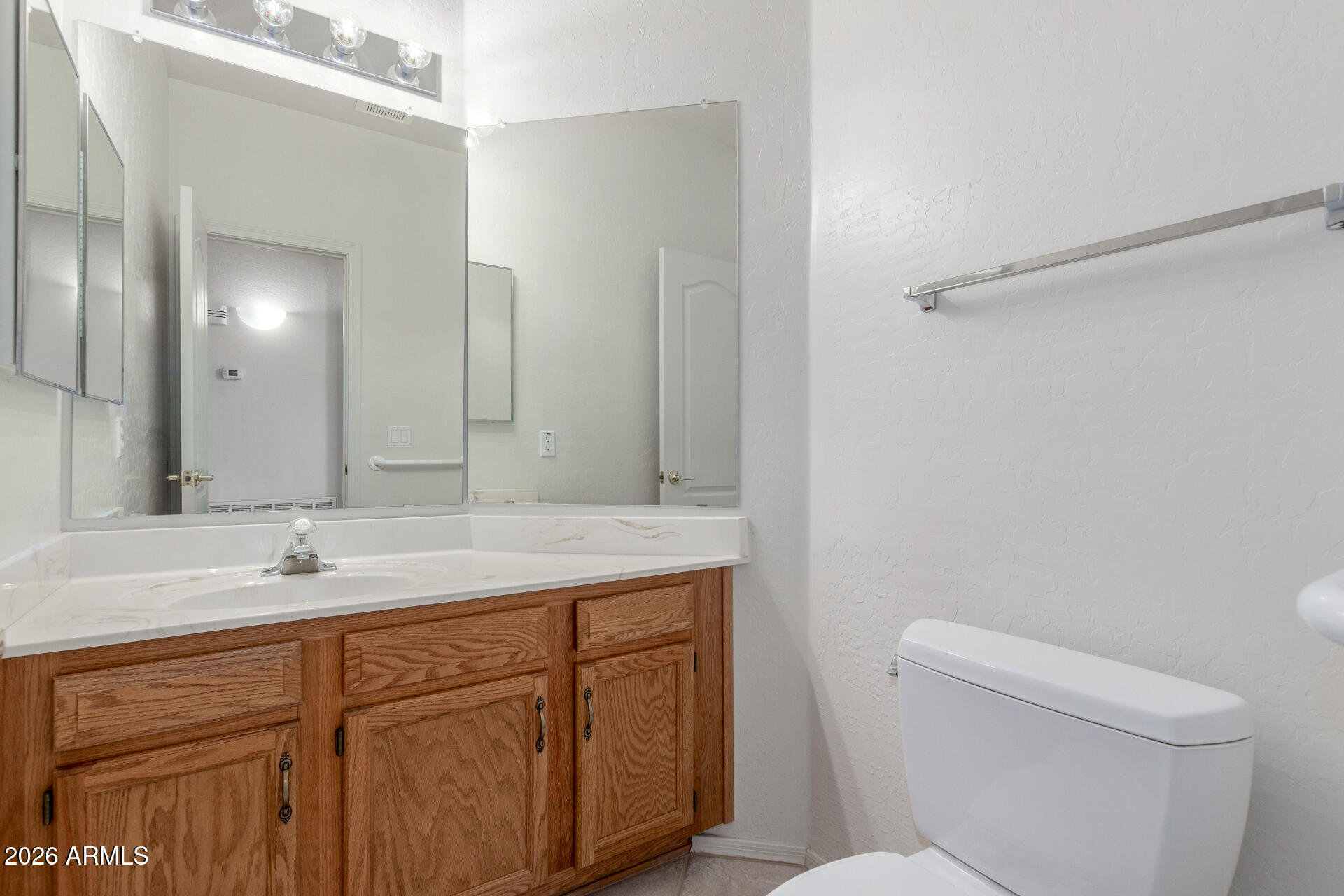 3430 North Mountain Ridge, Unit 13 Mesa, AZ 85207 - Photo 30 of 115 a bathroom with a toilet sink and mirror