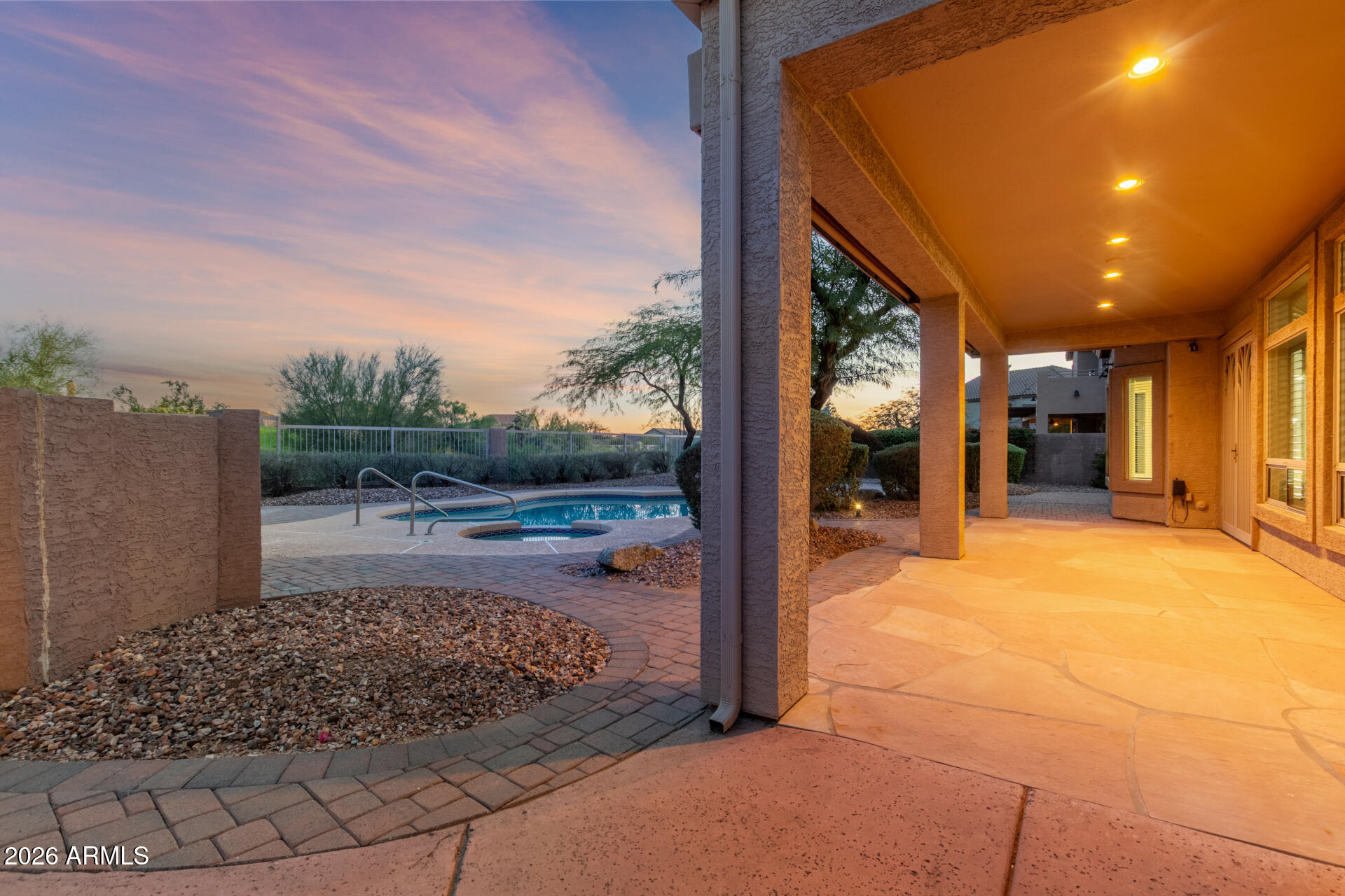 3430 North Mountain Ridge, Unit 13 Mesa, AZ 85207 - Photo 57 of 115 a view of a patio with table and chairs near a yard