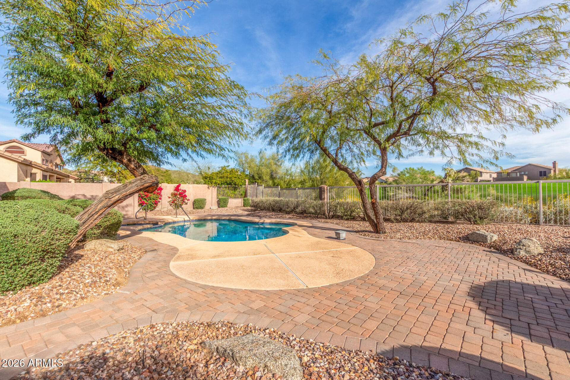 3430 North Mountain Ridge, Unit 13 Mesa, AZ 85207 - Photo 87 of 124 a view of a swimming pool with a yard