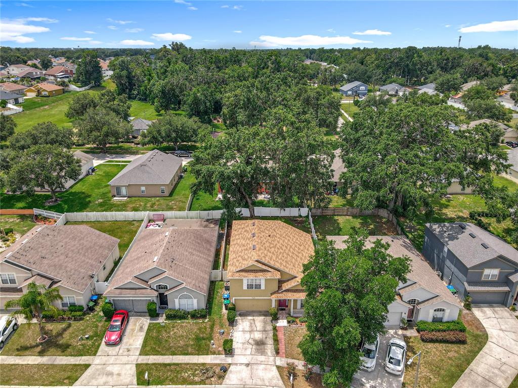 7939 Riffle Lane Orlando, FL 32818 - Photo 52 of 52 an aerial view of multiple houses with yard