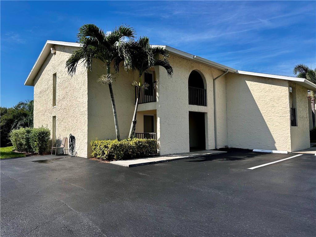 1815 Robalo Drive, Unit C201 Vero Beach, FL 32960 - Photo 23 of 31 a view of a house with a garage