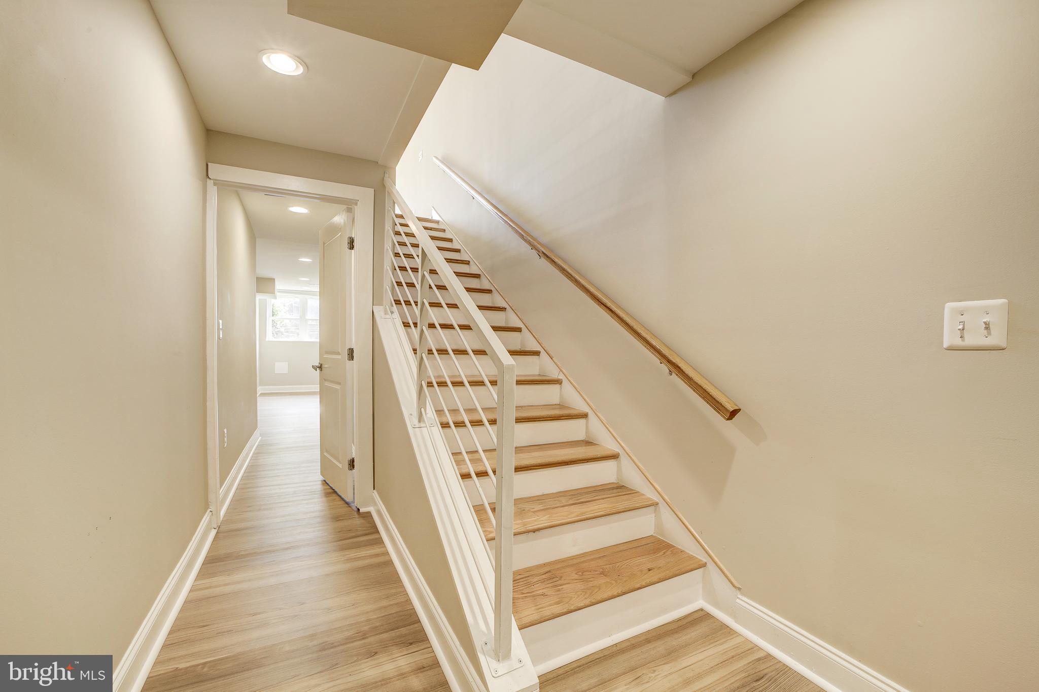 1926 1st Street Northwest, Unit 1 Washington, DC 20001 - Photo 26 of 37 a view of a hallway with wooden floor and entryway