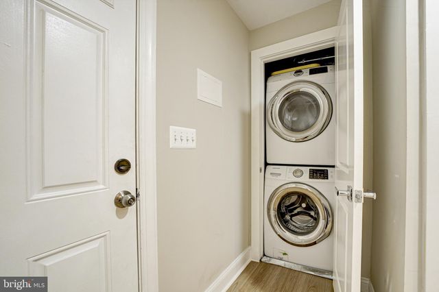 a view of a hallway with washer and dryer
