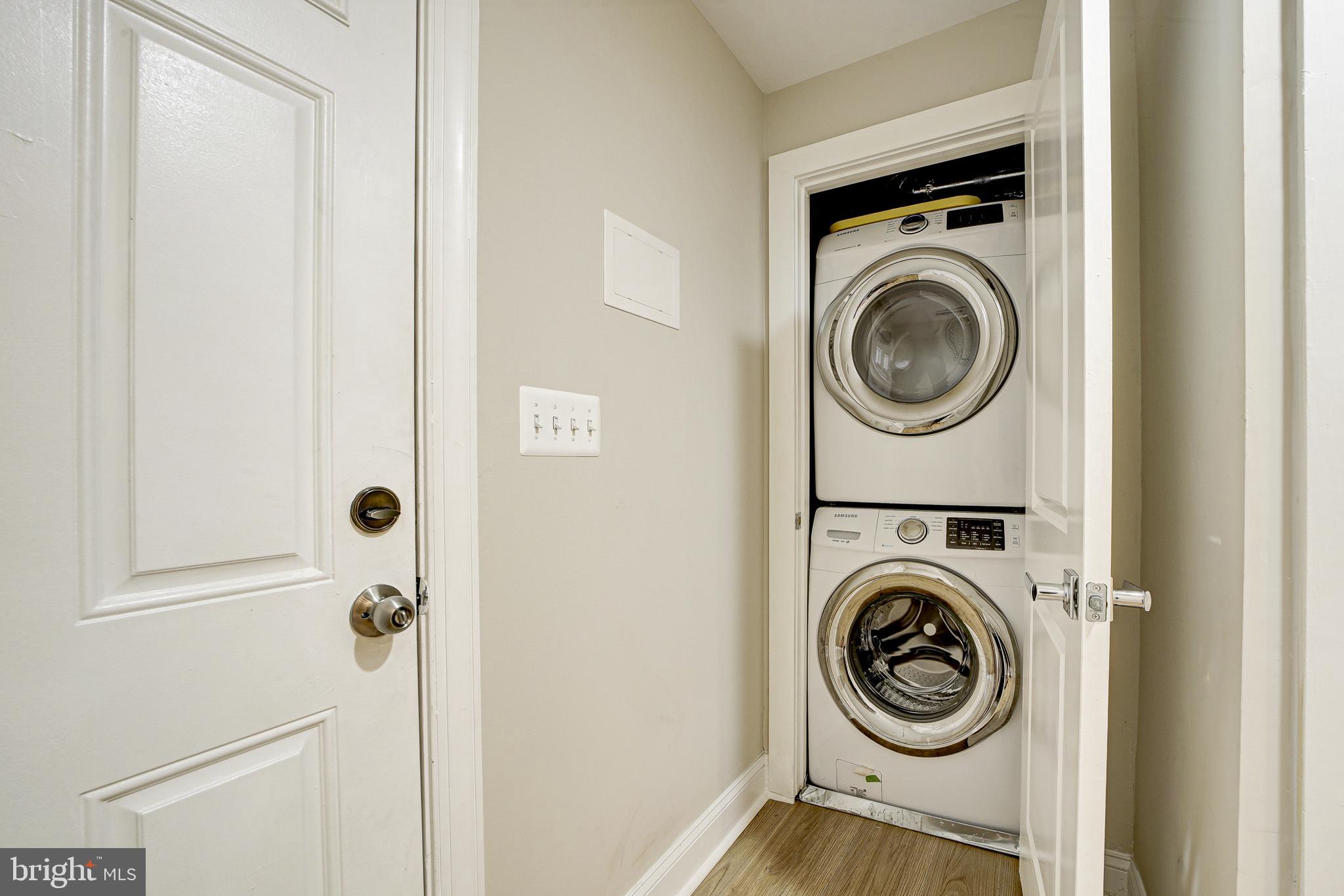 1926 1st Street Northwest, Unit 1 Washington, DC 20001 - Photo 30 of 37 a view of a hallway with washer and dryer
