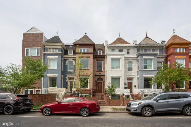 a view of a car parked in front of a building