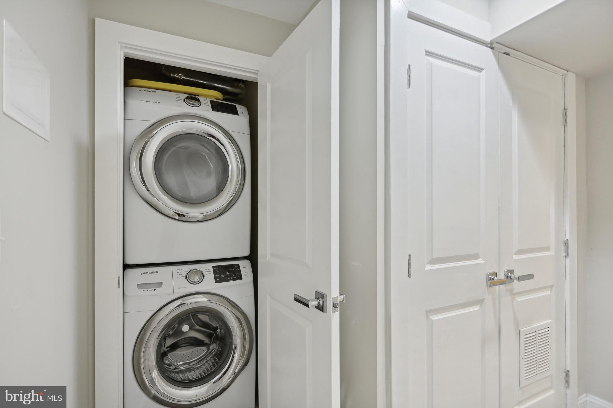 1926 1st Street Northwest, Unit 1 Washington, DC 20001 - Photo 31 of 37 a view of a hallway with washer and dryer