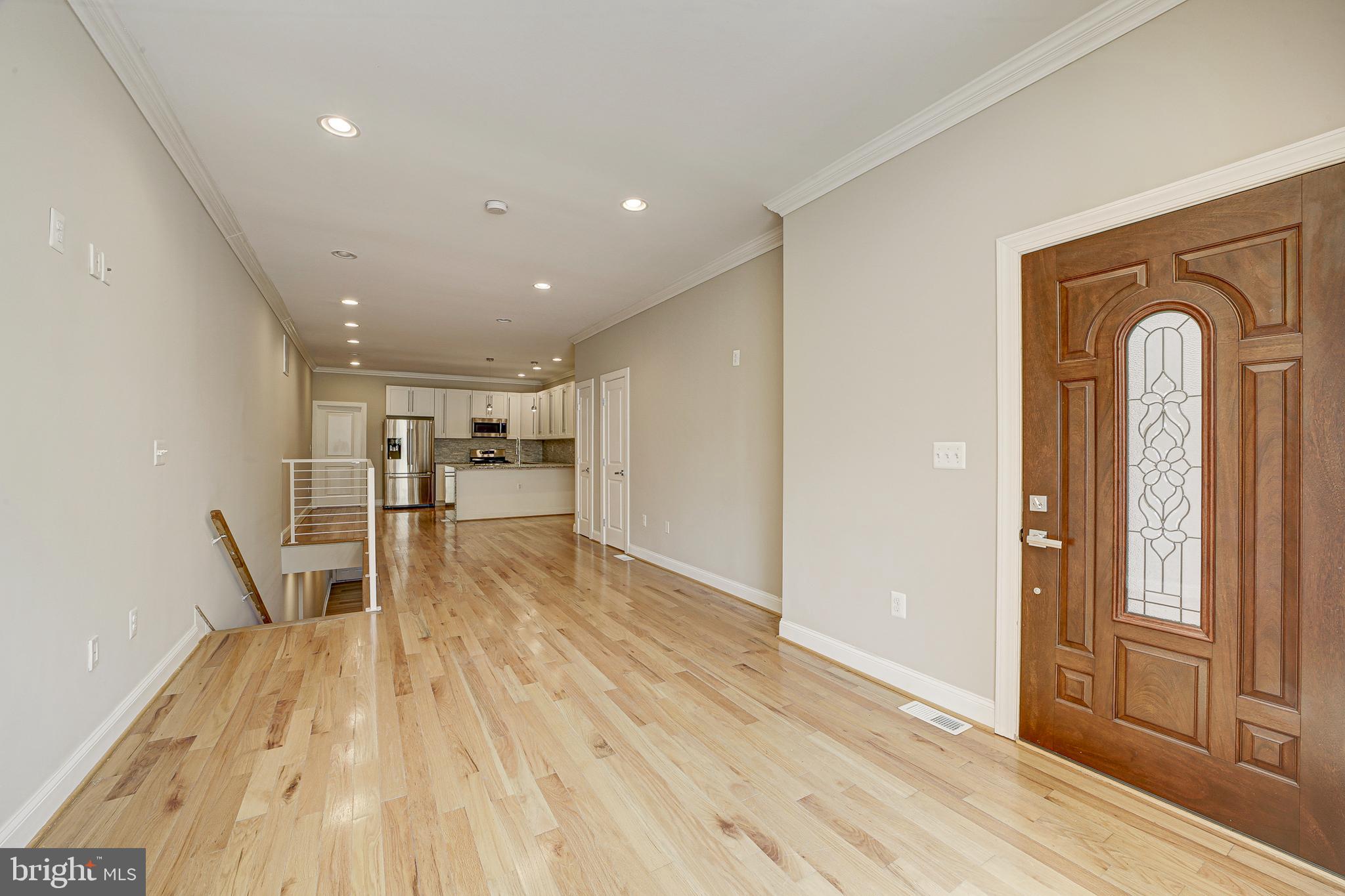 1926 1st Street Northwest, Unit 1 Washington, DC 20001 - Photo 5 of 37 a view of empty room with wooden floor