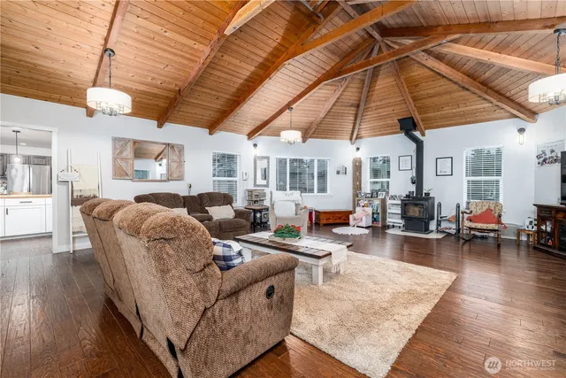 a living room with furniture and a umbrella