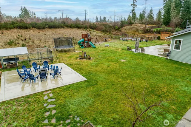 a view of a lake with a yard and a mountain