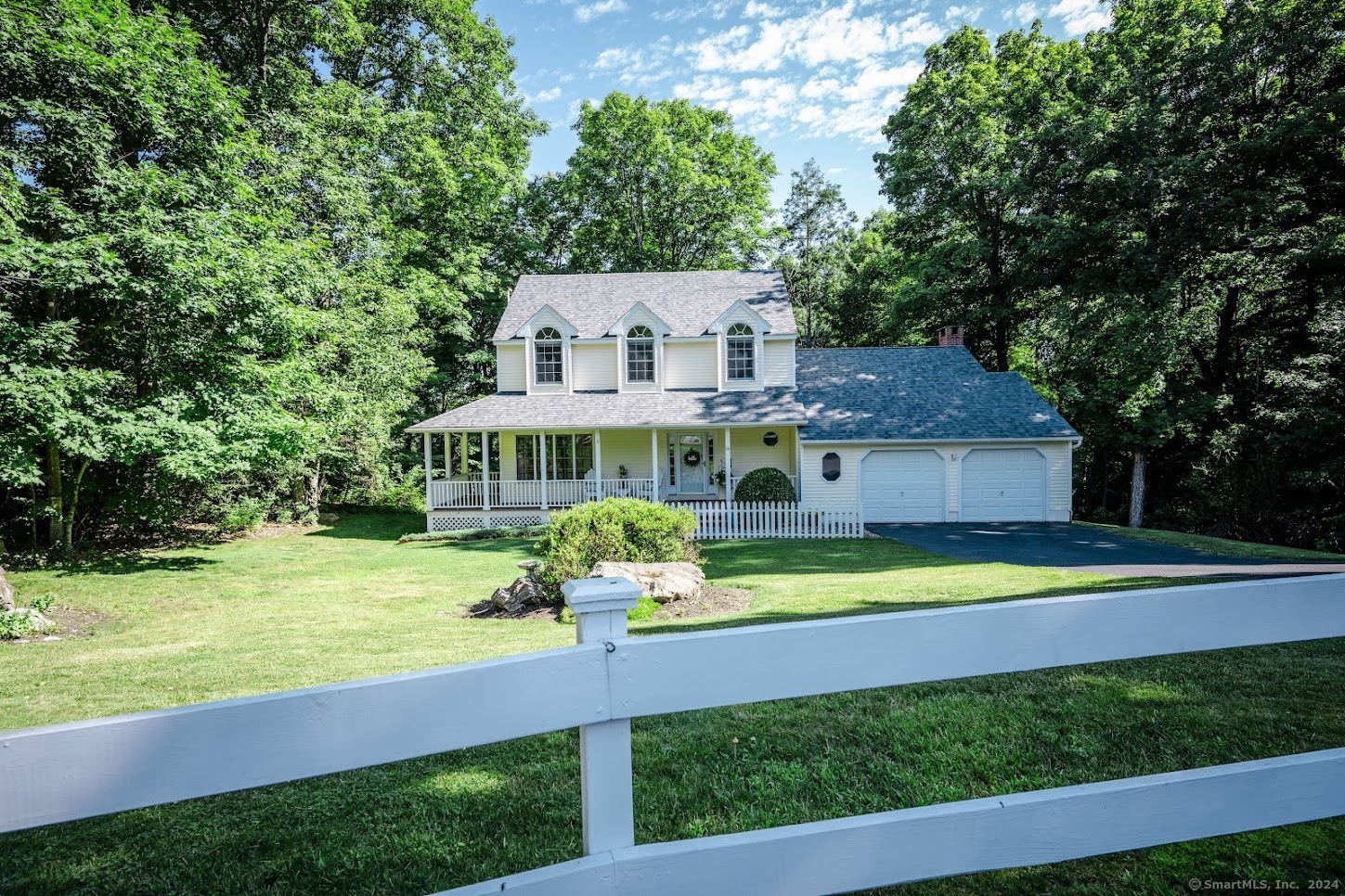 66 Laurelbrook Road Durham, CT 06422 - Photo 1 of 1 This pristine property invites you in with a welcoming front porch, perfect for relaxing in a rocking chair and enjoying the tranquil neighborhood.