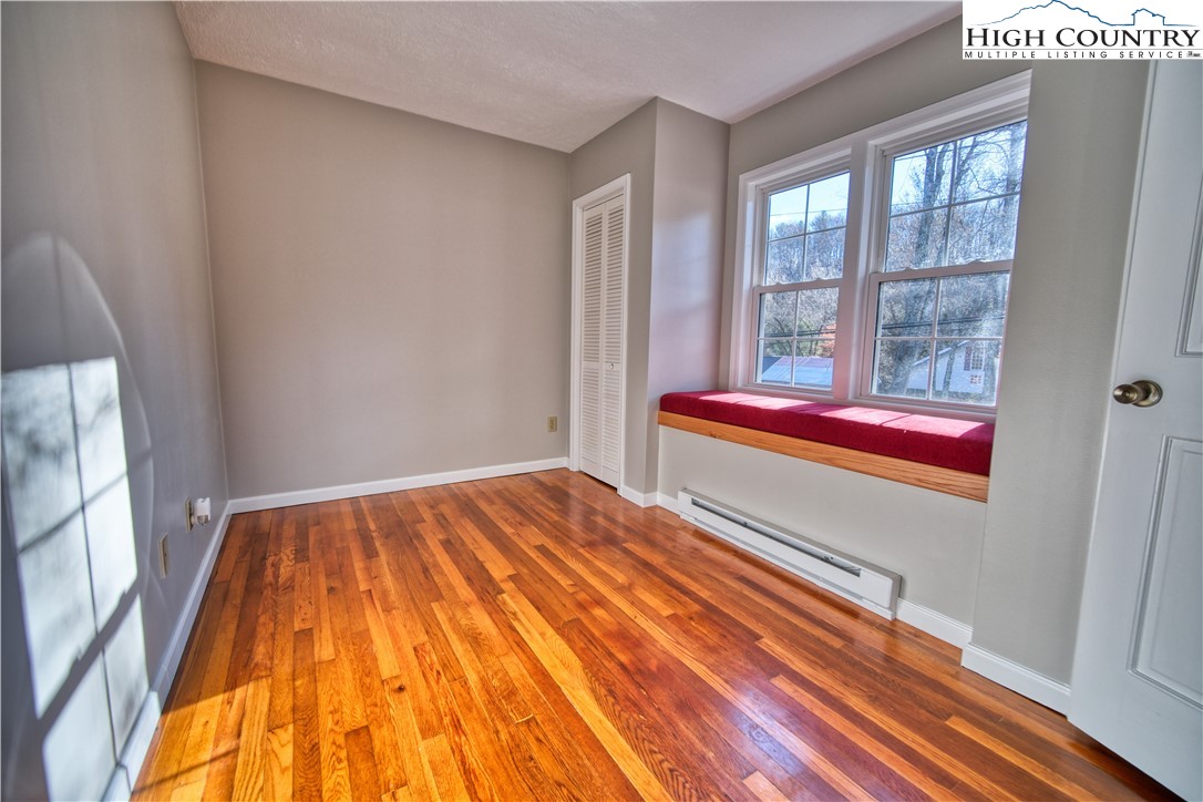 494 Frank Edwards Road West Jefferson, NC 28694 - Photo 15 of 27 a bedroom with a bed and a window