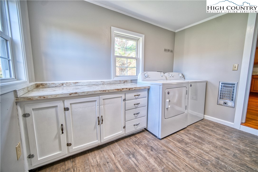 494 Frank Edwards Road West Jefferson, NC 28694 - Photo 17 of 27 a utility room with cabinets washer and dryer