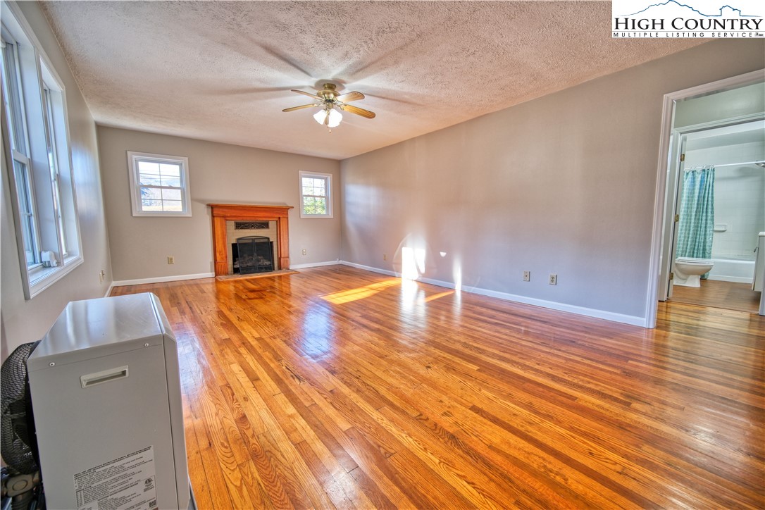 494 Frank Edwards Road West Jefferson, NC 28694 - Photo 8 of 27 a view of empty room with wooden floor and fan