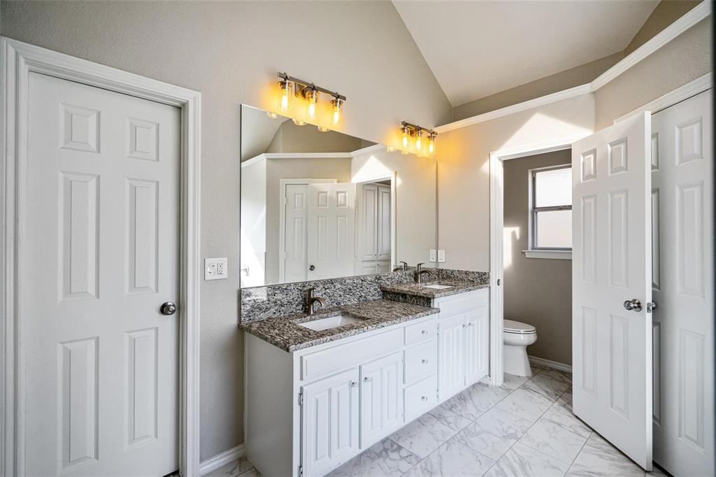 1006 Merribrook Lane Allen, TX 75002 - Photo 15 of 29 a bathroom with a granite countertop sink and a mirror