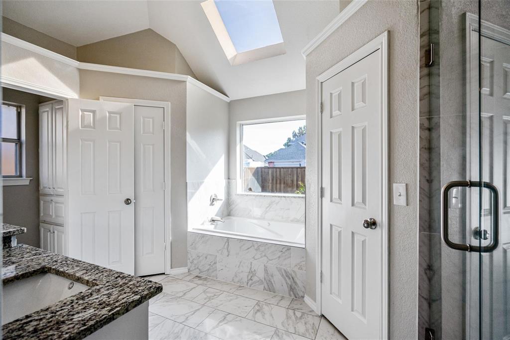 1006 Merribrook Lane Allen, TX 75002 - Photo 16 of 29 a bathroom with a granite countertop shower and a sink