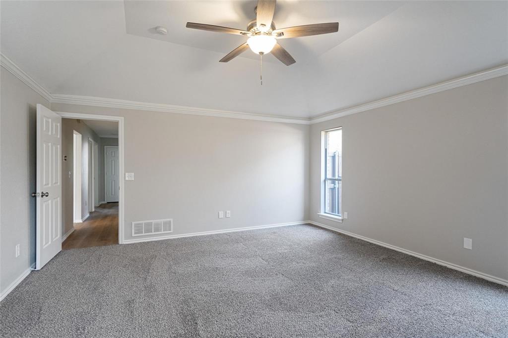 1006 Merribrook Lane Allen, TX 75002 - Photo 18 of 29 a view of an empty room and a ceiling fan window