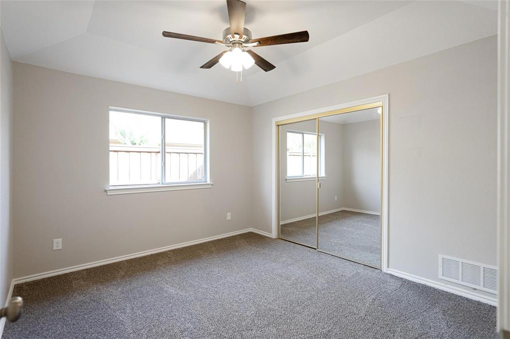 1006 Merribrook Lane Allen, TX 75002 - Photo 20 of 29 an empty room with windows and fan
